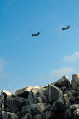 Chinook Helicopter fly over California jetty photo