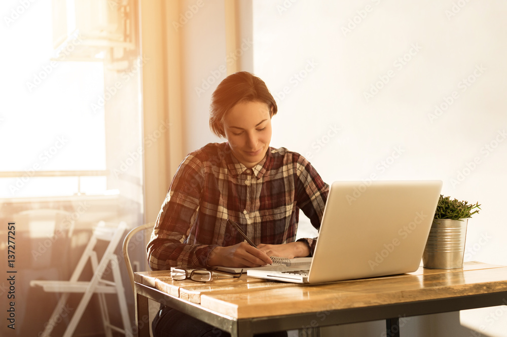 Taking notes at home, working on computer, lens flare Taking notes at home, working on computer, lens flare