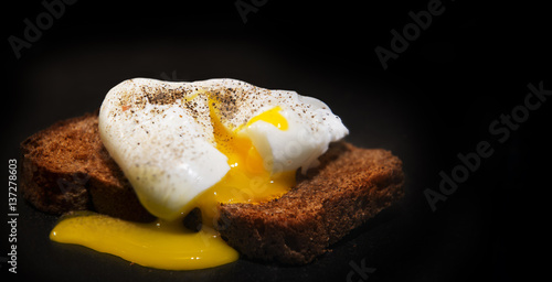 Poached egg on a slice of wholemeal bread.