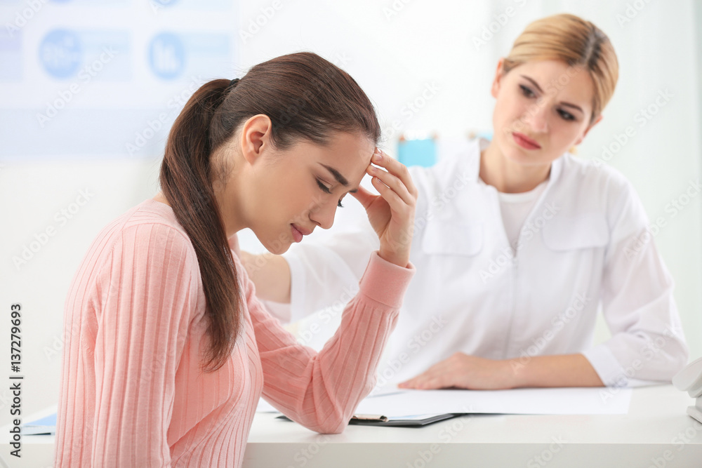 Young depressed woman at doctor's office Young depressed woman at doctor's office