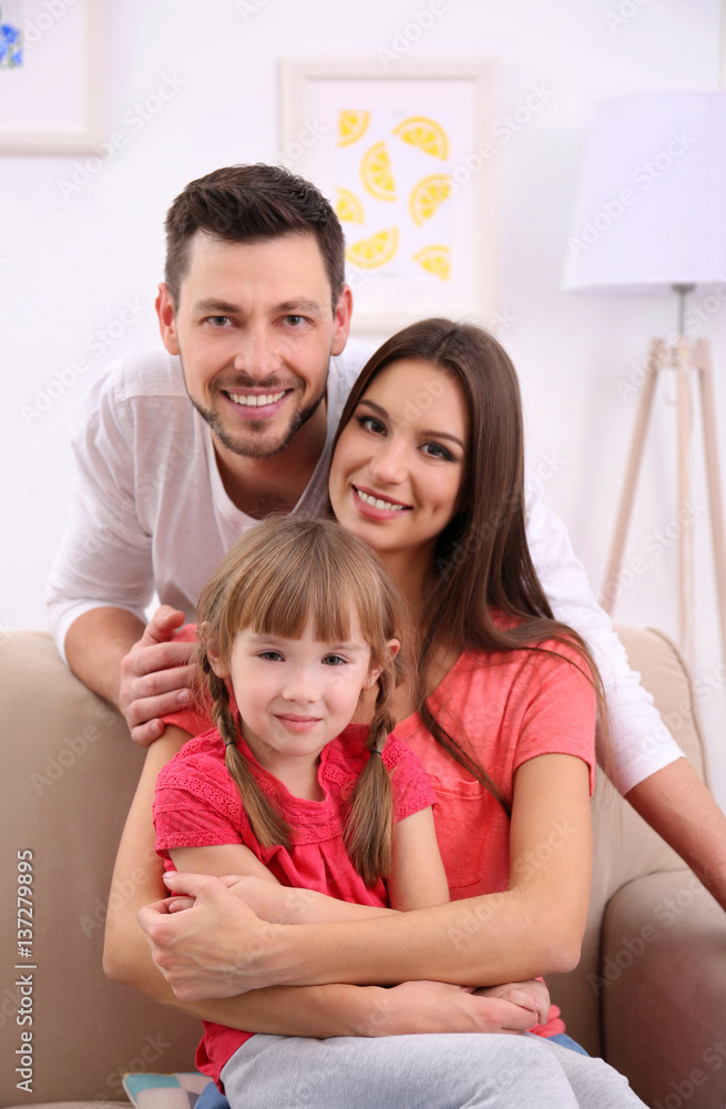 Happy family on sofa at home Happy family on sofa at home