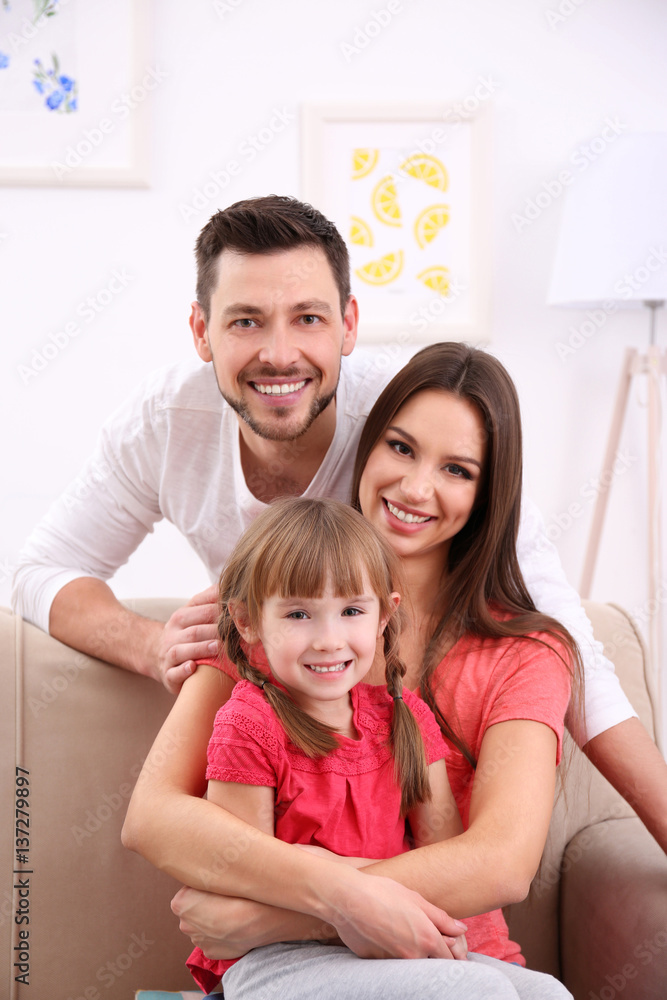 Happy family on sofa at home Happy family on sofa at home