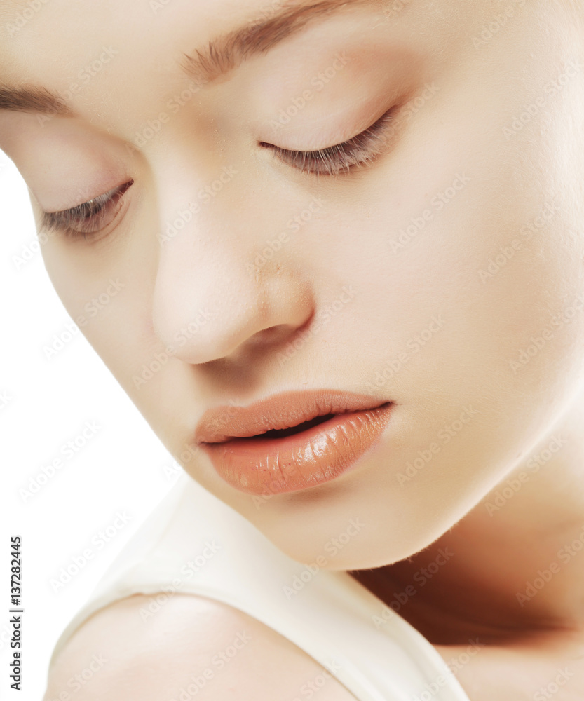 Obraz premium Beautiful woman face with clean skin over white background