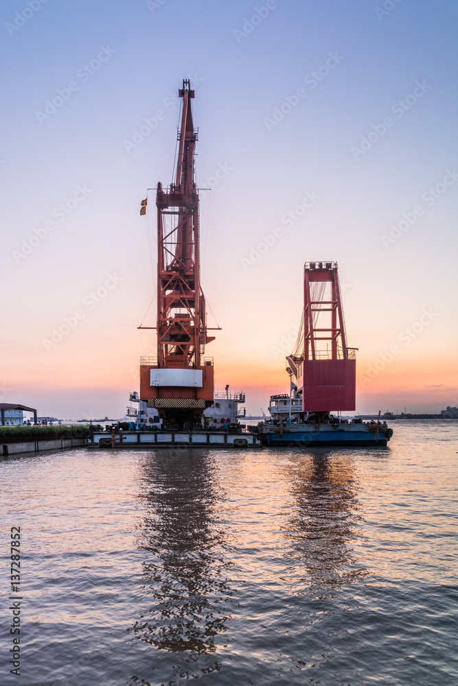 Cargo container ship at harbor in city of China. Cargo container ship at harbor in city of China.
