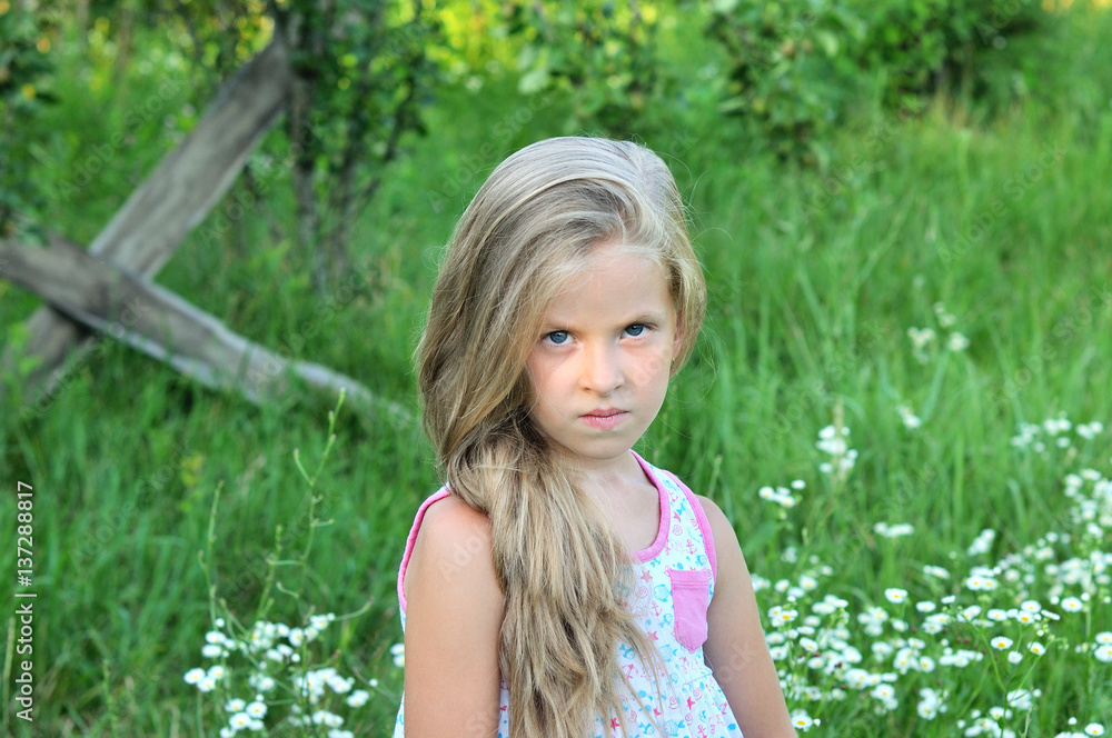 Portrait of a little girl on a green background. Portrait of a little girl on a green background.