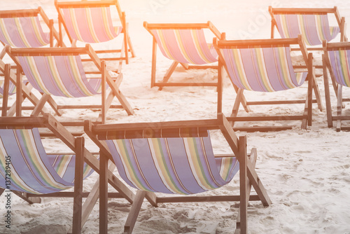 Image processing sun shining  Beach chair or bed in the sand by the sea  concept of relaxing and enjoying on summer vacation.