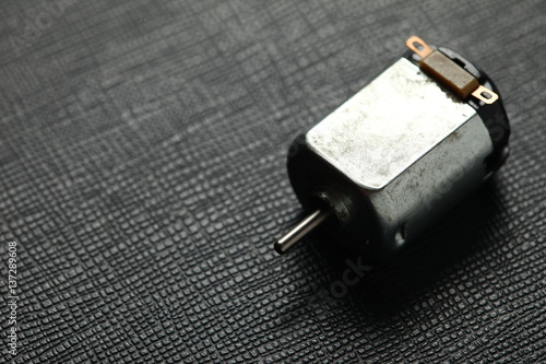 The old and dirty small electric motor represent the electric equipment concept related idea.