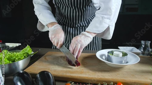 Chef Hand Slice Beetroot And Adds In On Salad photo