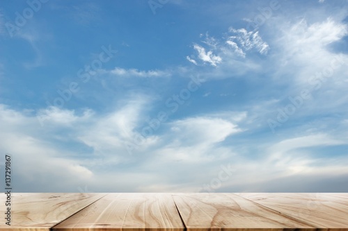 Wood table top on blue sky, used for display your products