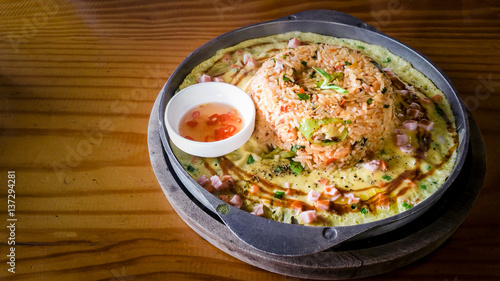 spicy fried rice ( Tom Yum ) seafood with mixed vegetable and cheese  in cast iron pan spicy taste at Thai styled food