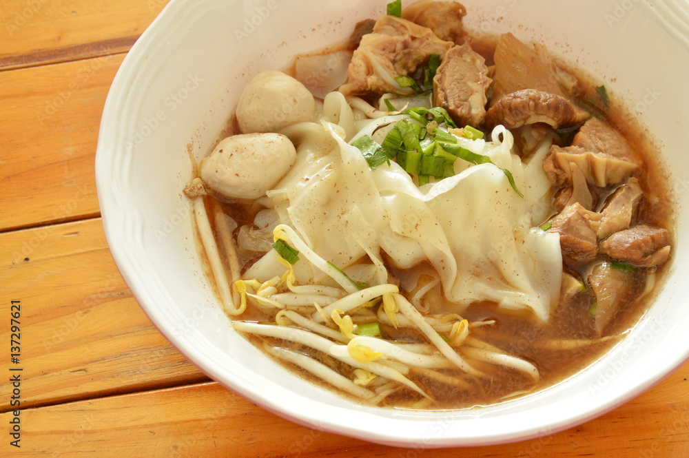large rice noodle with braised pork and ball in brown soup large rice noodle with braised pork and ball in brown soup
