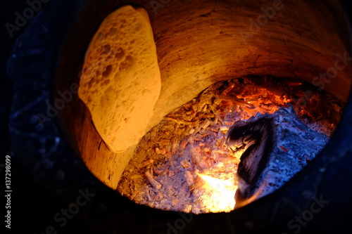 Turkish bread in tandoor photo