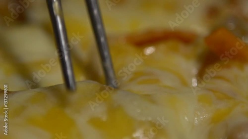 Slow Motion Cuisine Dakgalbi Korean food. people used chopsticks for eating a Spicy grilled chicken and veal mix with vegetables and melted cheese in restaurant Korea, Slow-Motion rate of 120 fps-Dan photo