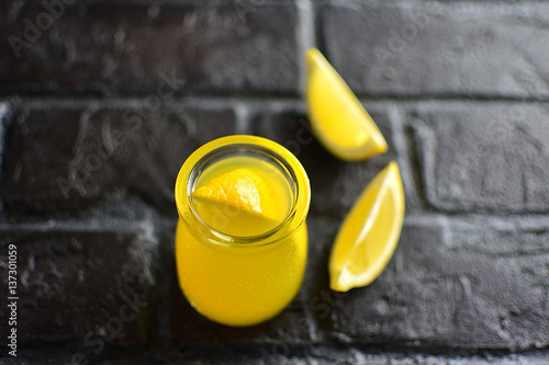 The lemon Detox drink glass jar in a dark background