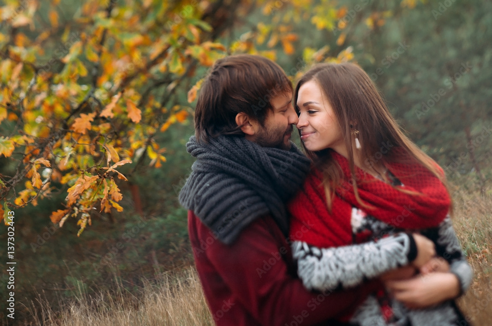 Stylish man and woman in a scarf on nature Stylish man and woman in a scarf on nature