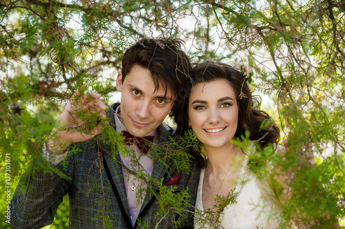 happy couple in front of blooming nature © illustrissima