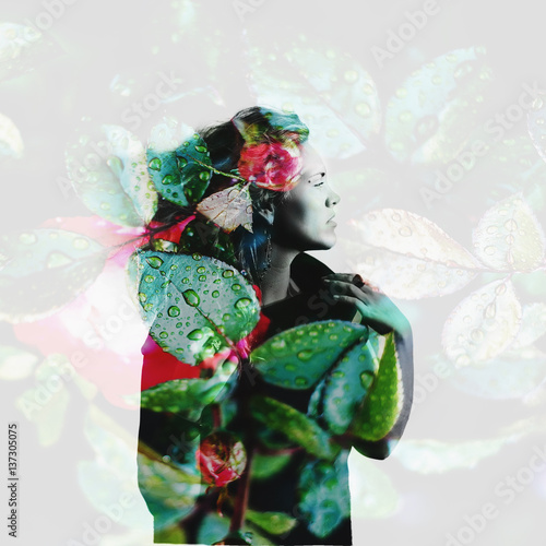 Double exposure portrait of attractive woman combined with photograph of flowers