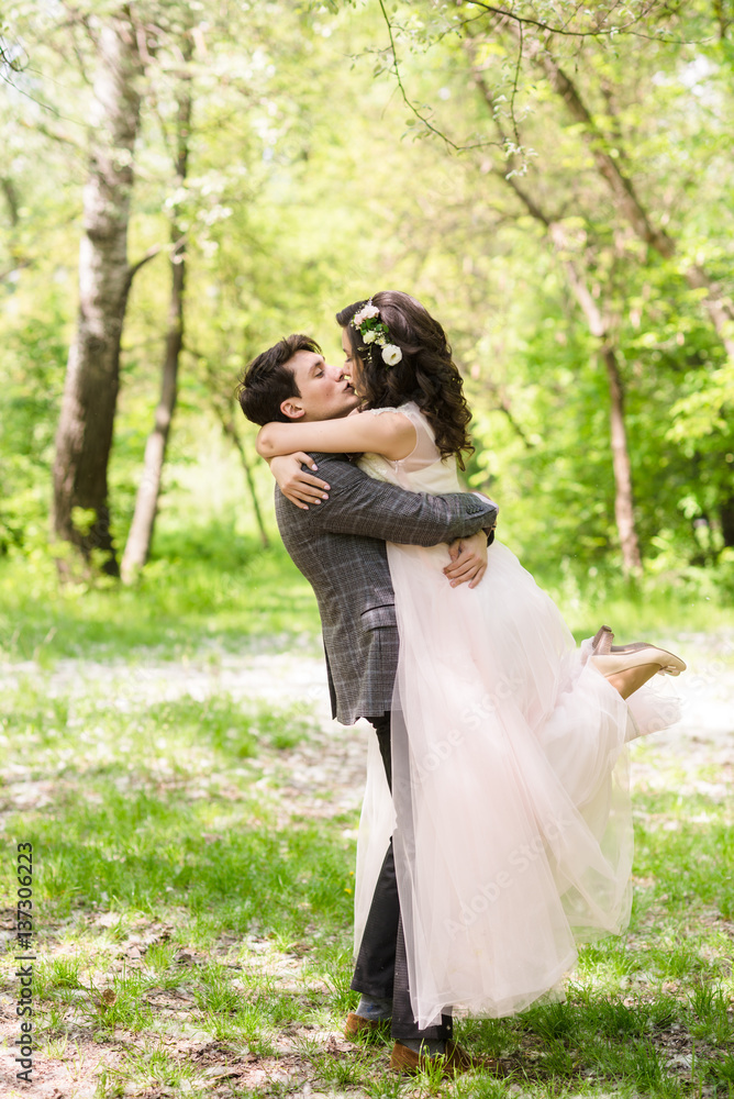 groom and bride outdoor back view groom and bride outdoor back view