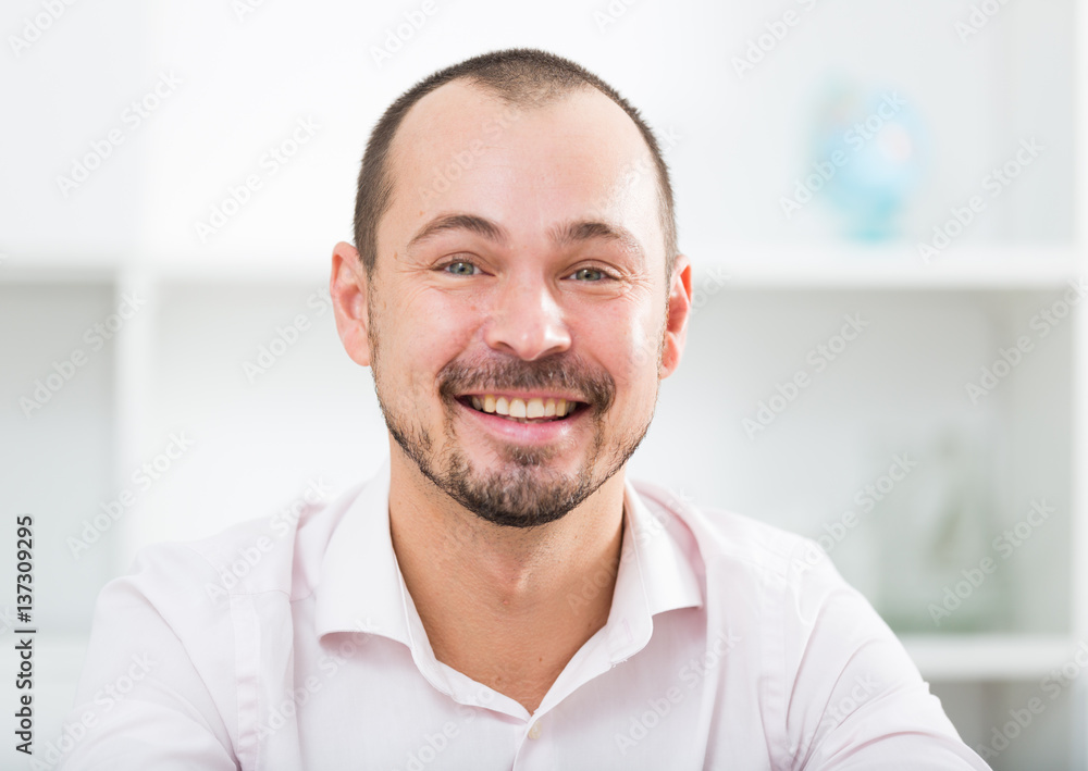 Fototapeta premium Positive young man in office