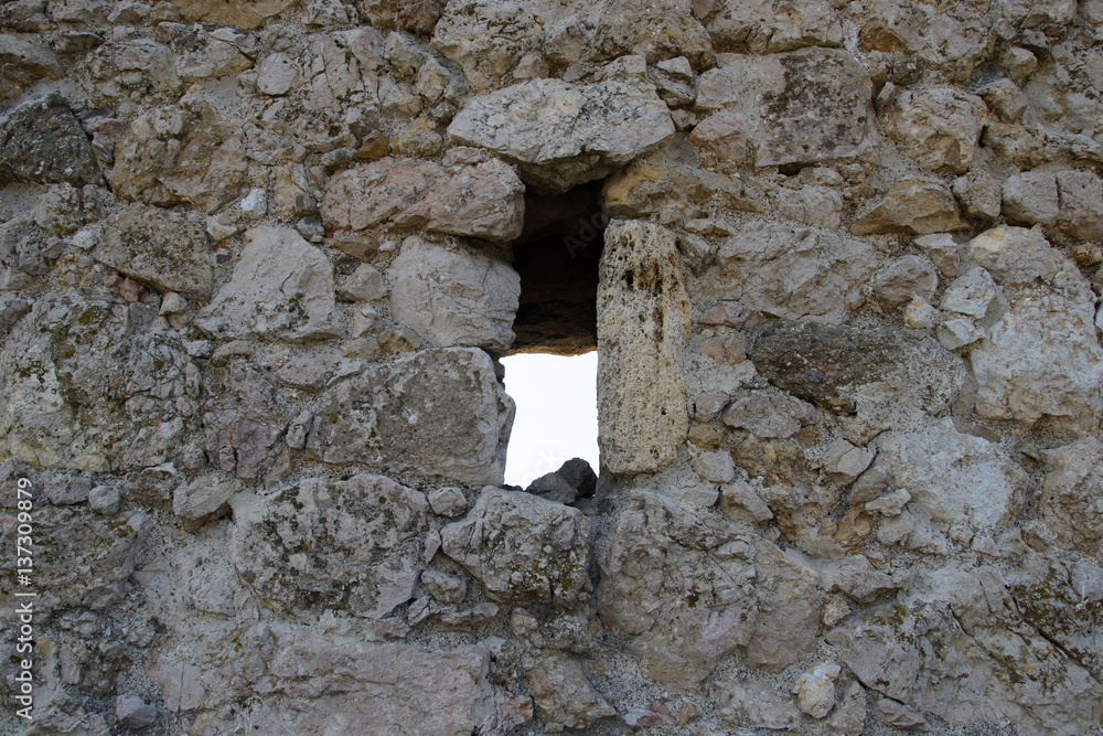 castle window in stone wall