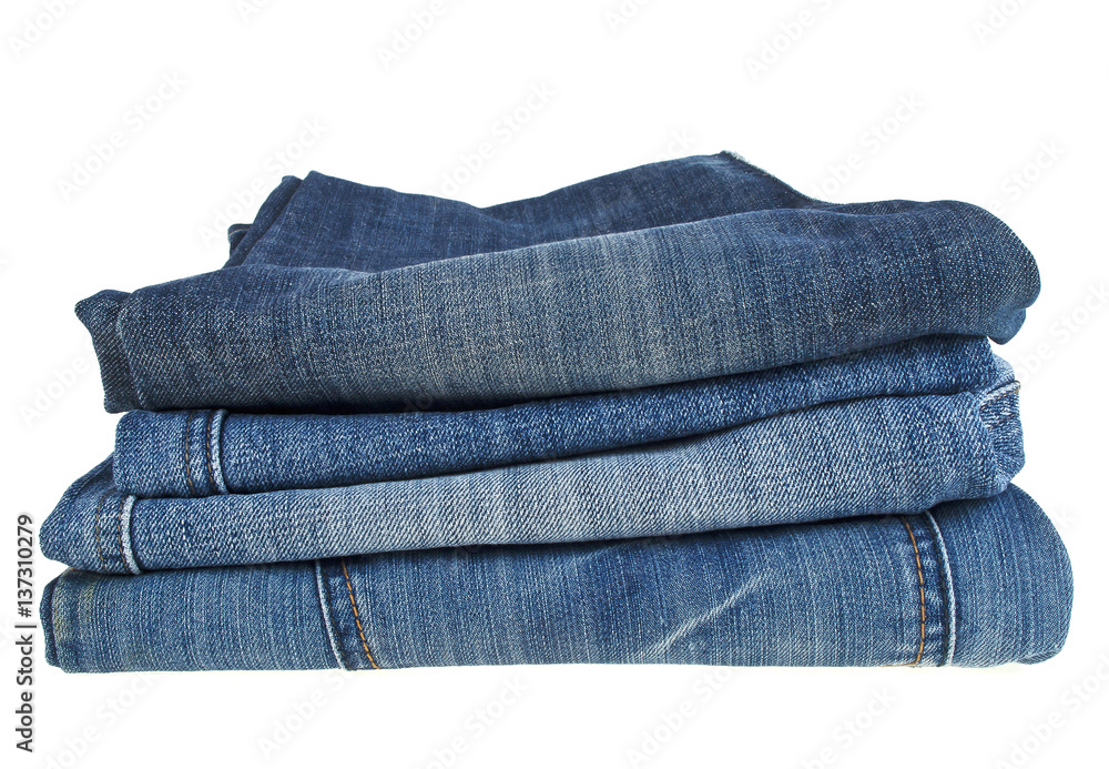 Lot of different blue jeans isolated on white background Lot of different blue jeans isolated on white background