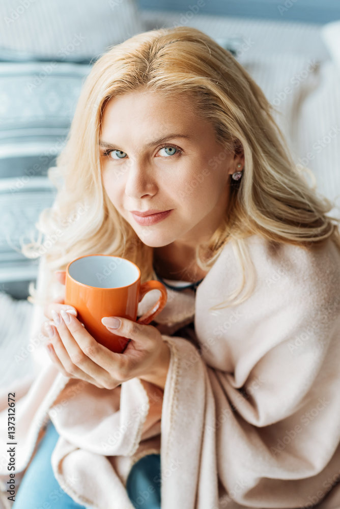 Pleasant beautiful woman drinking tea at home Pleasant beautiful woman drinking tea at home