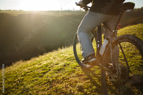 closeup of rear wheel sports bike. race mountainbike on the hill.