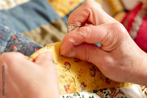 close-up of the hands of a seamstress
