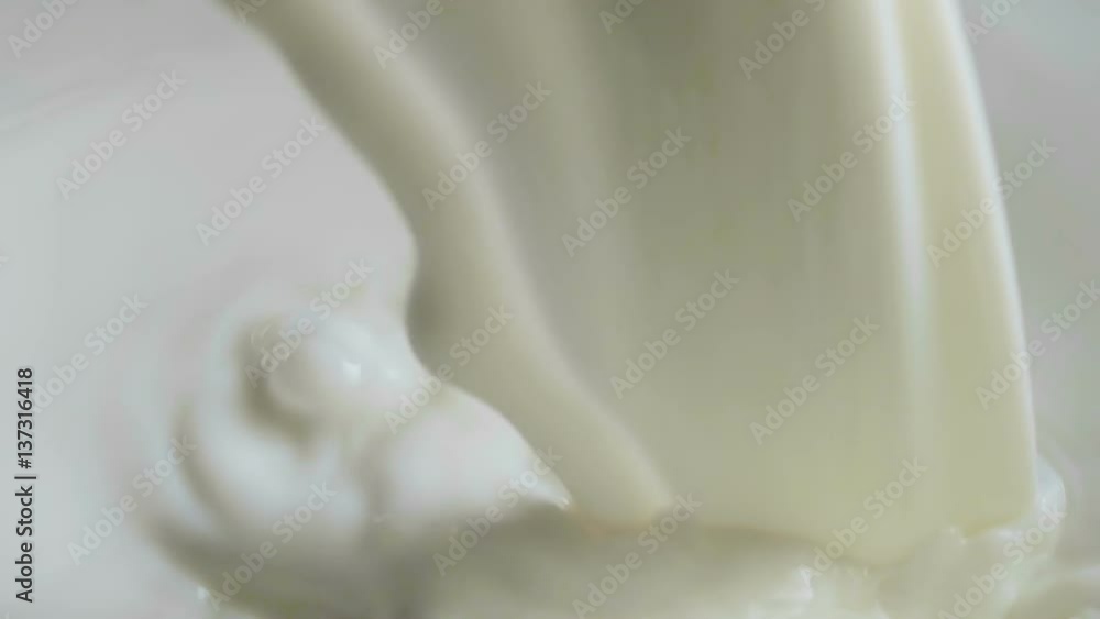 Pouring Milk Splash With Bubbles Slow Motion Closeup Pouring Milk Splash With Bubbles Slow Motion Closeup