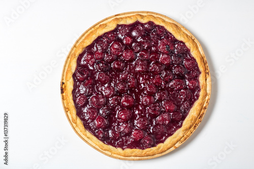 American homemade cherry pie on the table. Horizontal top view