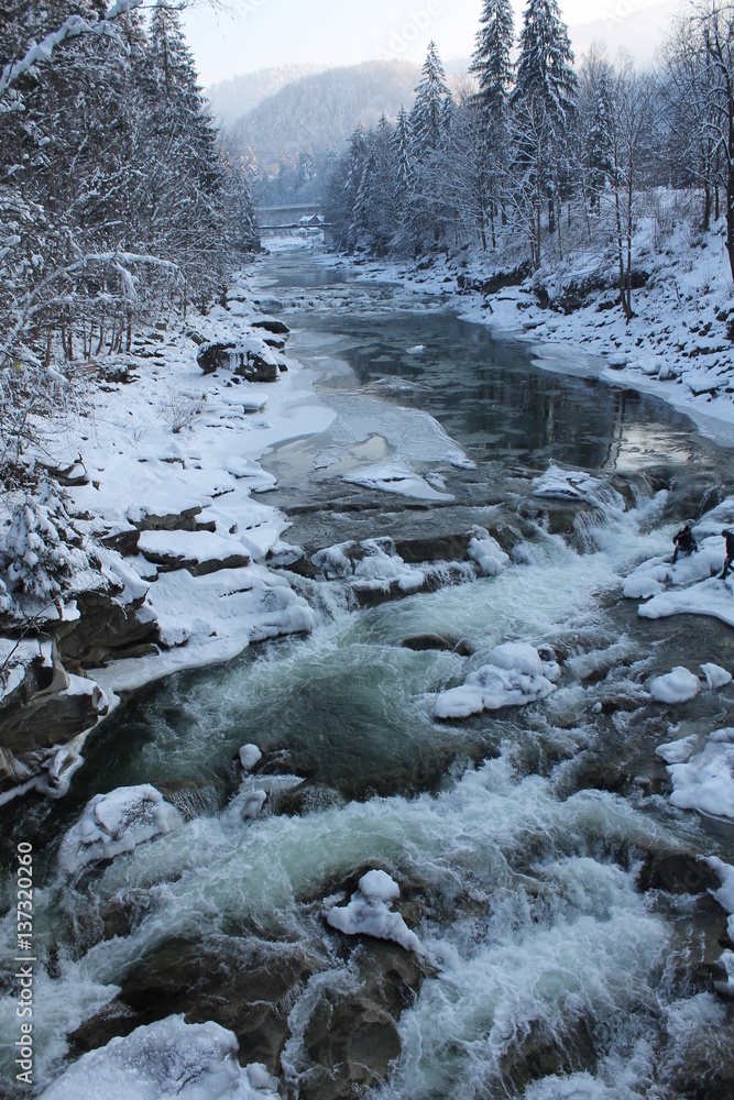 Mountains, a mountain river in winter Mountains, a mountain river in winter