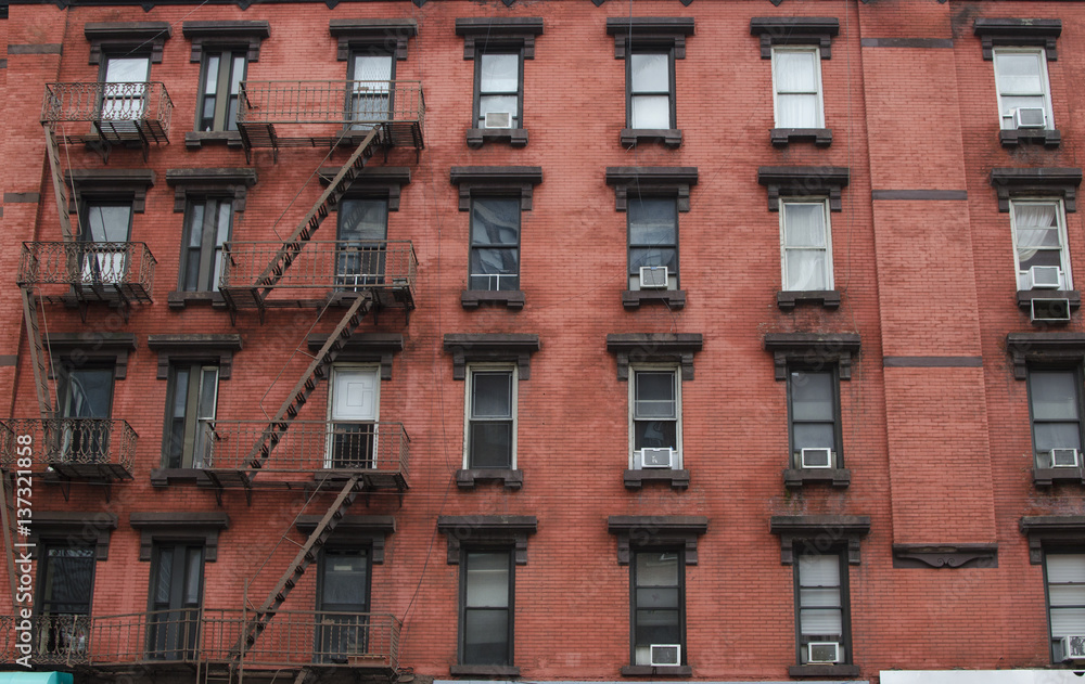 Obraz premium The typical old houses with fire stairs in Manhattan New York