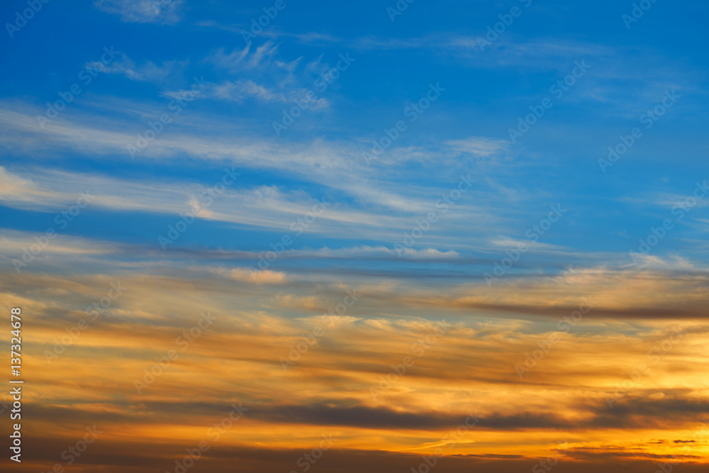 Fototapeta premium Sunset sky orange clouds over blue