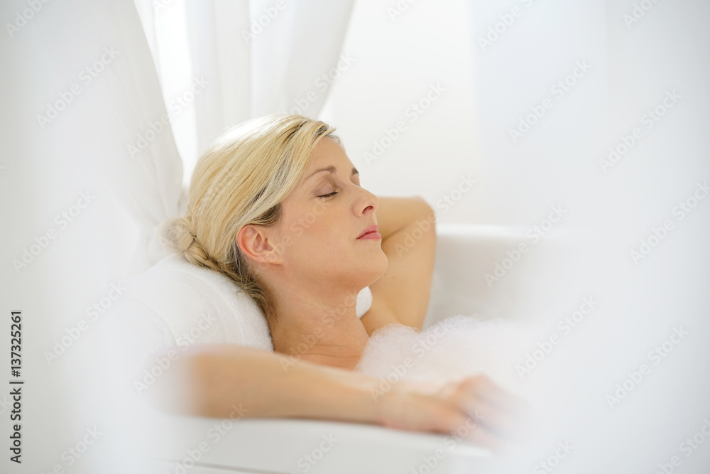 Beautiful blond woman relaxing in bathtub Beautiful blond woman relaxing in bathtub