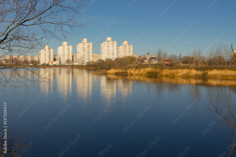 city between the sky and water. blue background.