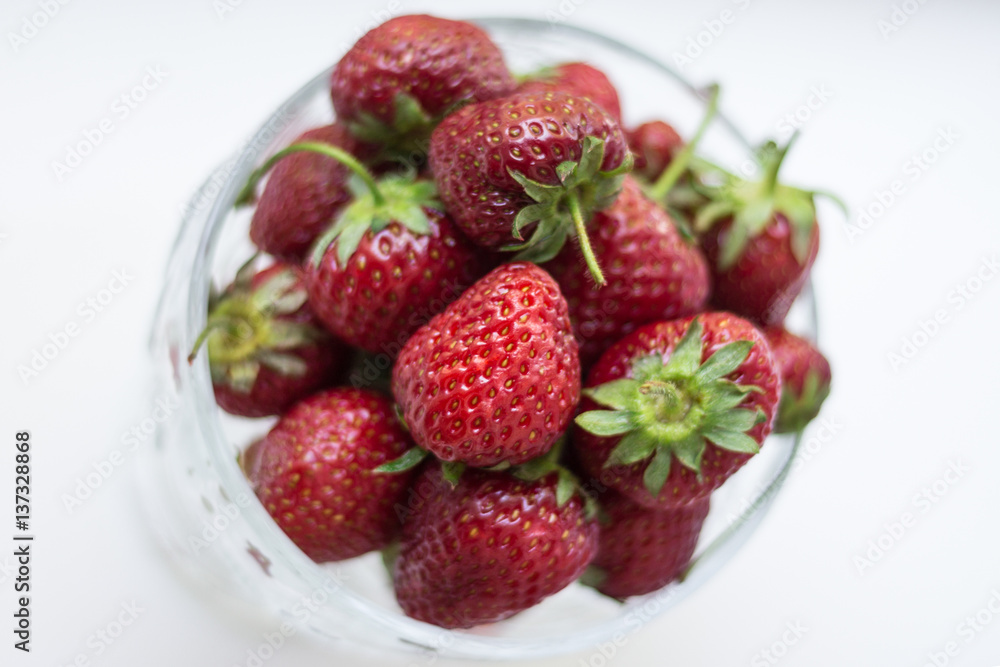 sweet fragrant strawberries in a glass vase isolated on white background sweet fragrant strawberries in a glass vase isolated on white background