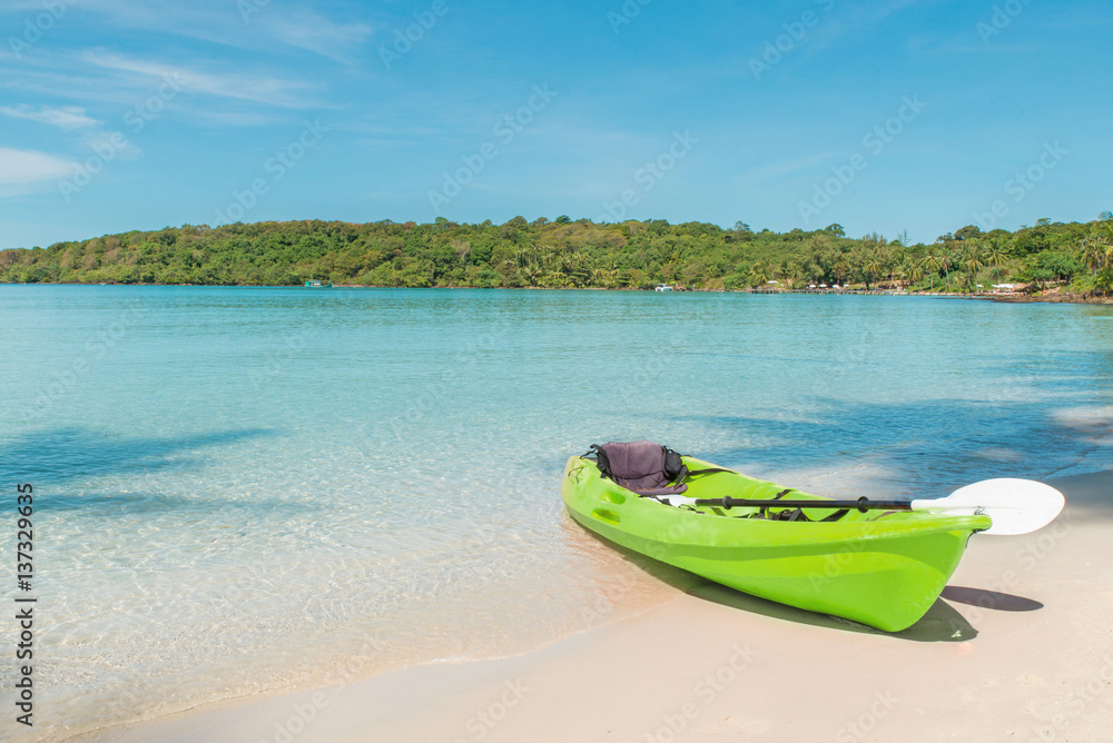 Green kayaks on the tropical beach in Phuket, Thailand. Summer, Vacation and Travel concept. Green kayaks on the tropical beach in Phuket, Thailand. Summer, Vacation and Travel concept.
