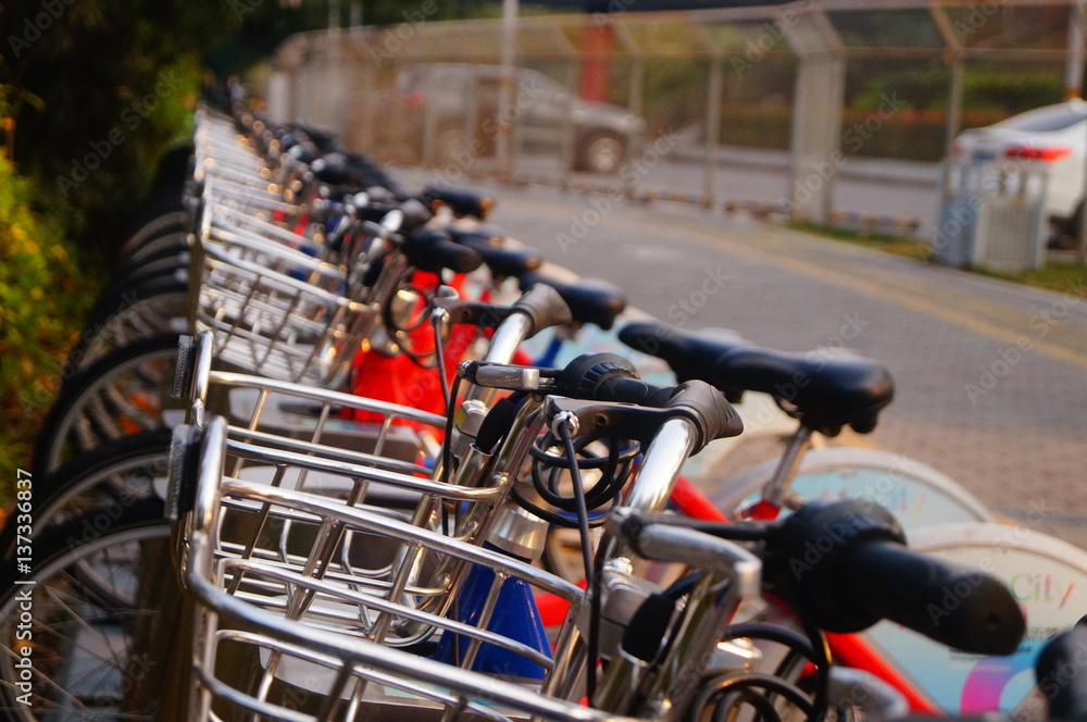 Bicycle rental facilities and a row of bicycles in the streets. In Shenzhen, china. Bicycle rental facilities and a row of bicycles in the streets. In Shenzhen, china.