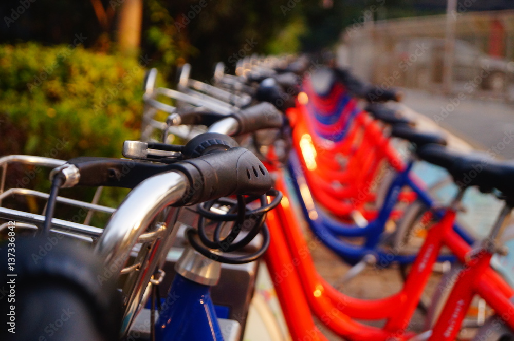 Bicycle rental facilities and a row of bicycles in the streets. In Shenzhen, china. Bicycle rental facilities and a row of bicycles in the streets. In Shenzhen, china.