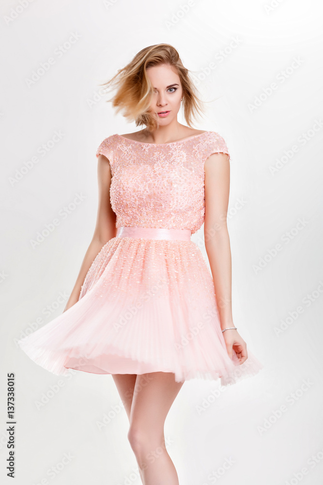 beautiful sensual and sexy blond woman in pink cocktail dress po beautiful sensual and sexy blond woman in pink cocktail dress po