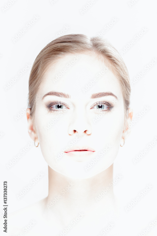 overexposed portrait of beautiful young blonde woman with green 