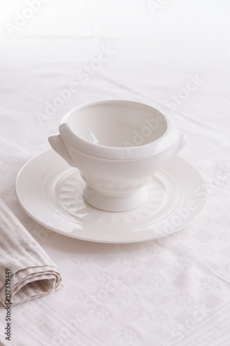 exquisite porcelain plate white. white empty plate on a white background