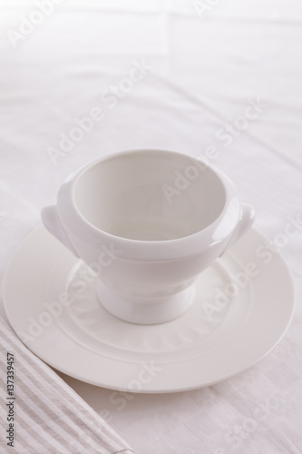 exquisite porcelain plate. white empty plate on a white background