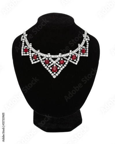 Pendant with red gem stones on black mannequin isolated on white