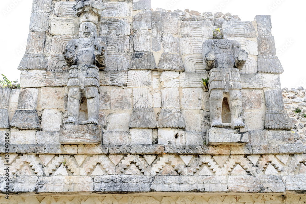 Mayan sculptures in the palace of the masks or Codz Poop in the archaeological kabah enclosure in Yucatan, Mexico.