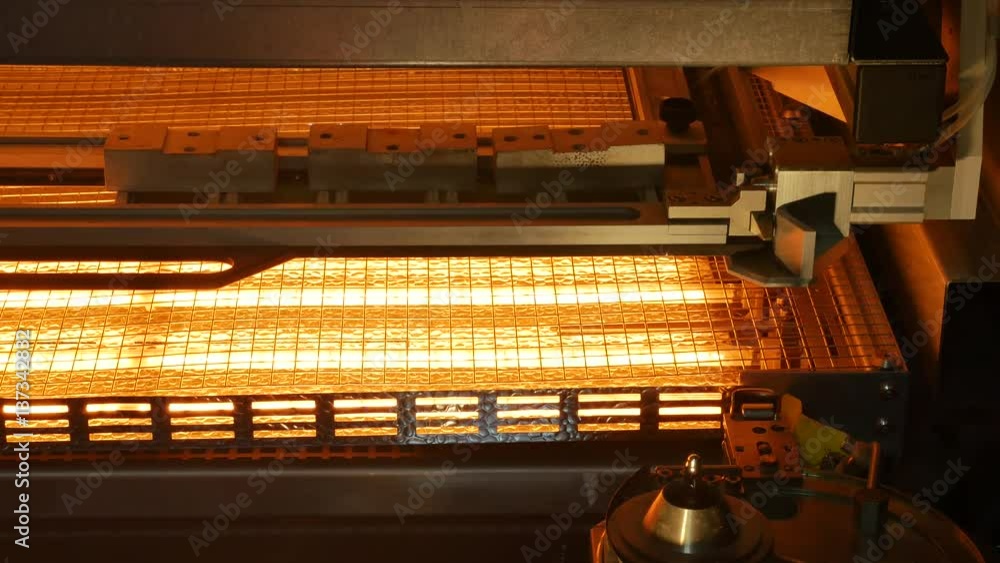 A printed circuit board is being heated before soldering process A printed circuit board is being heated before soldering process