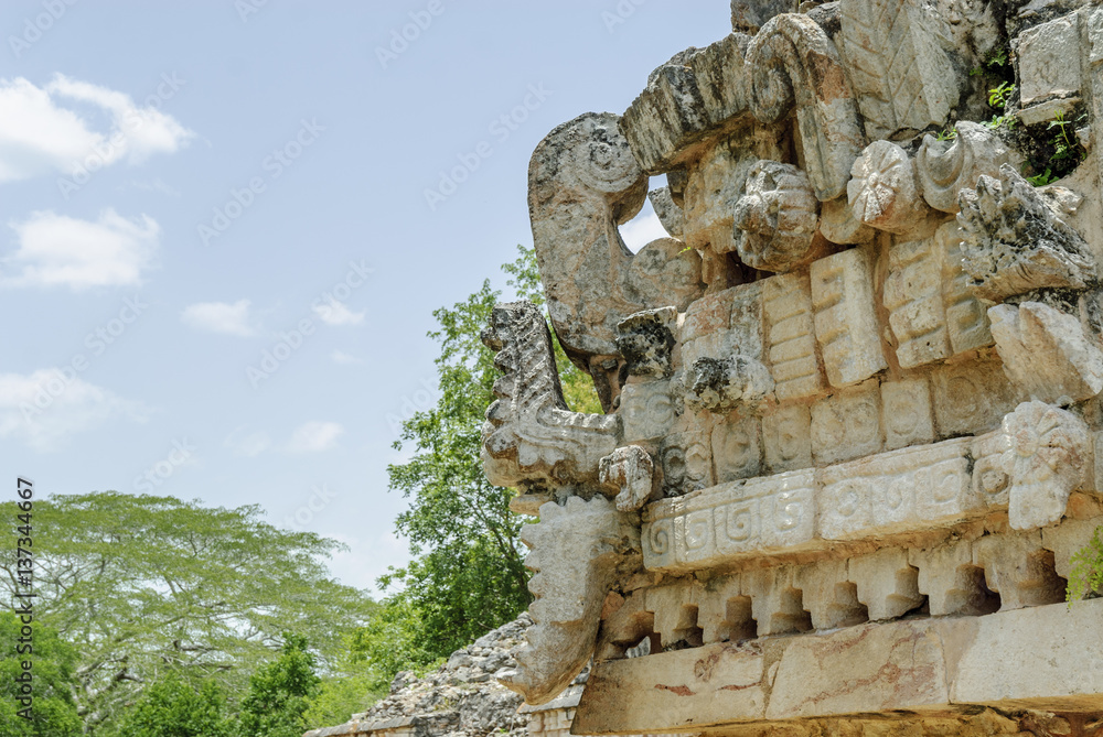 relief with the mask of the Mayan god kukulkan in a building of the palace in ruins of the archaeological enclosure of Labna in Yucatan, Mexico.