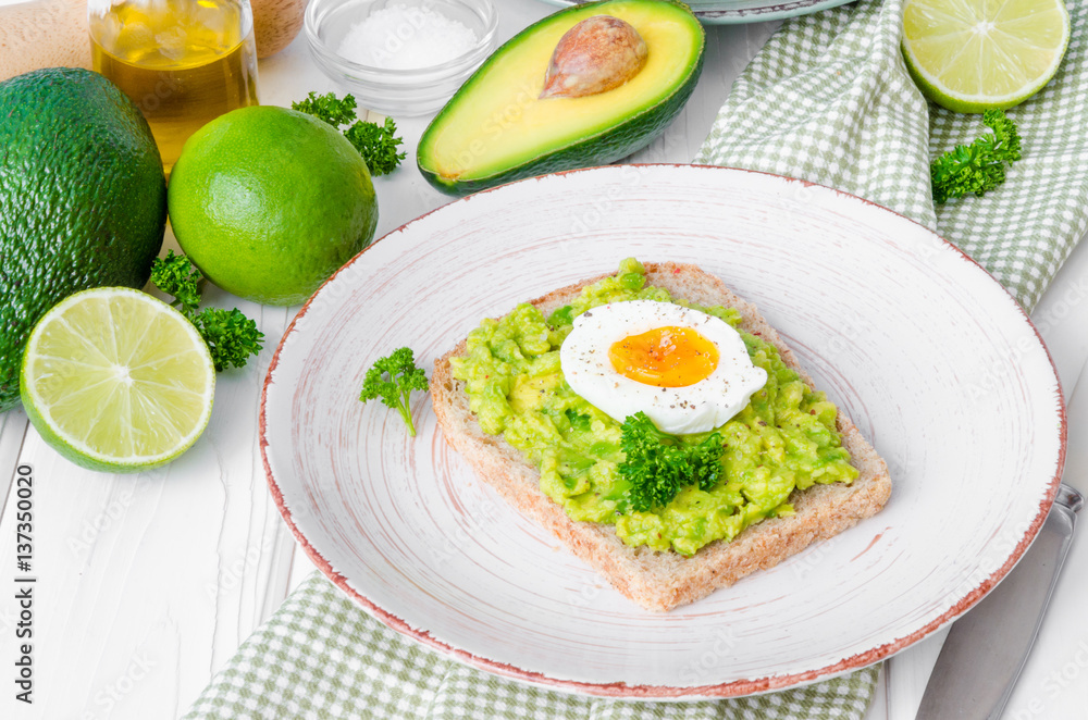 Sandwich with whole grain bread, mashed avocado and boiled eggs Sandwich with whole grain bread, mashed avocado and boiled eggs