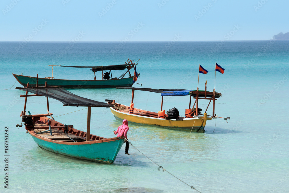 Cambodian boats with flags