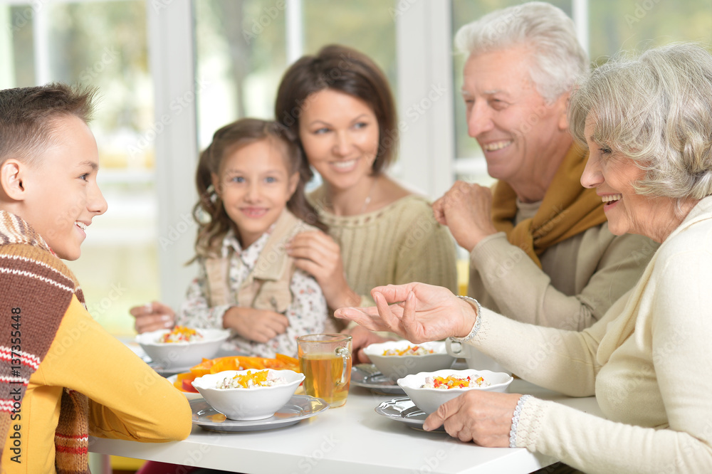 family eating dinner family eating dinner